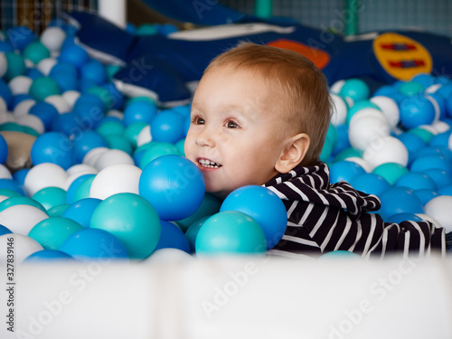 a small child plays in a children's entertainment center