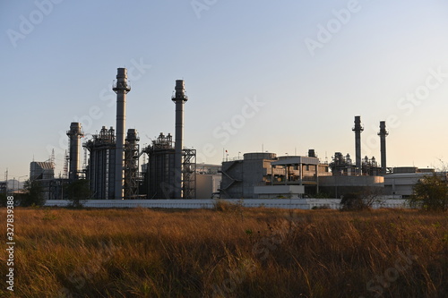 Natural gas combine cycle power plant and turbine generator in dusk with  twilight