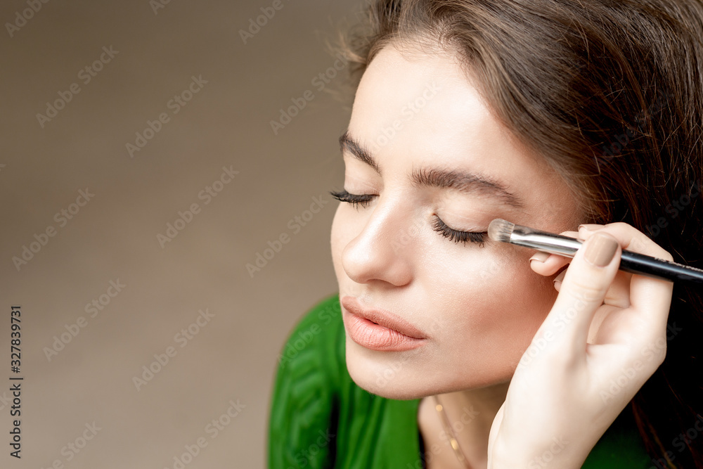 Fototapeta premium Makeup artist applying eyeshadow.