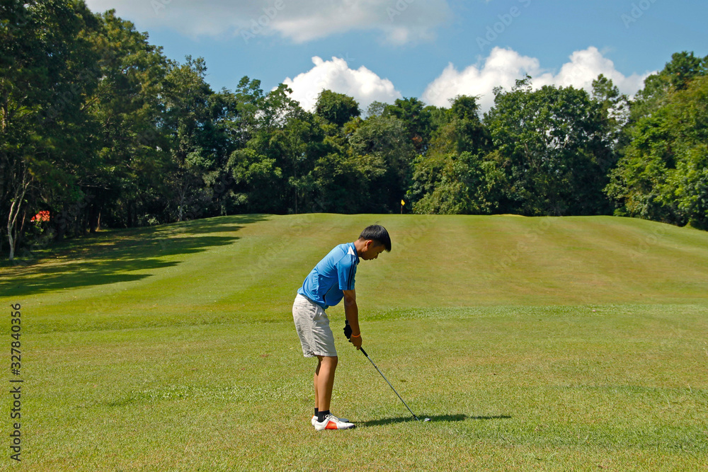 Golfer playing golf in beautiful golf course in the evening golf course