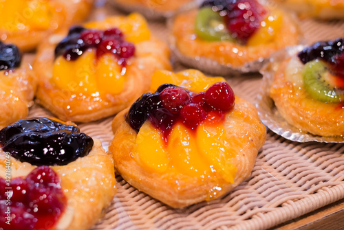 Honey Arabic Fruit Cake. Honey cake. Home made cake with beautiful fresh fruit decoration. Celebrating happy birthday.