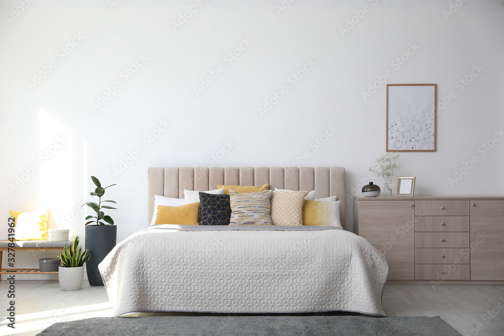 Stylish interior of contemporary room with comfortable bed Stylish interior of contemporary room with comfortable bed