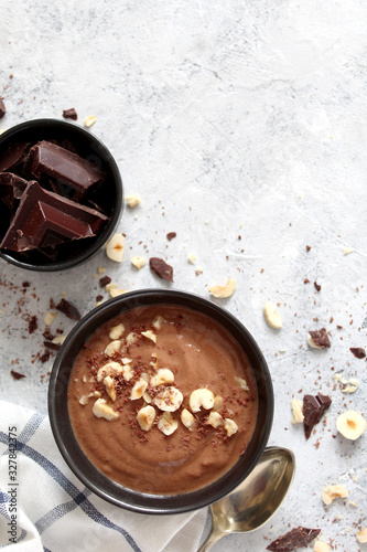 Chocolate smoothie with banana and nuts. Top view with copy space. Protein smoothie.