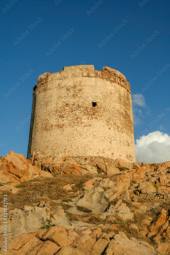 Capo Testa lighthouse in Sardinia on the rocks overlooking the blue sea Capo Testa lighthouse in Sardinia on the rocks overlooking the blue sea
