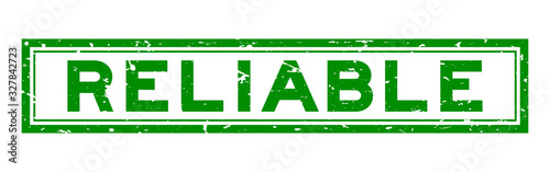 Grunge green reliable word rubber seal stamp on white background