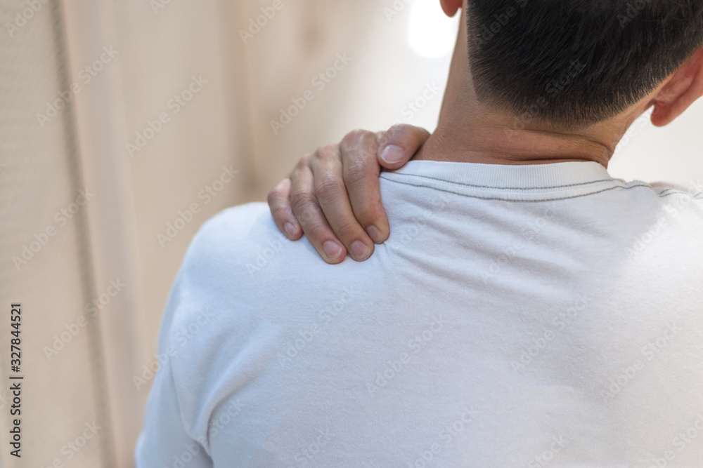 Man with hand squeeze at red spot shoulder as suffering from pain or itchy. Male hurt at shoulder and neck as sick from psoriasis,Thoracic Outlet Syndromes, Rotator Cuff Injury,Bursitis,Fibromyalgia Man with hand squeeze at red spot shoulder as suffering from pain or itchy. Male hurt at shoulder and neck as sick from psoriasis,Thoracic Outlet Syndromes, Rotator Cuff Injury,Bursitis,Fibromyalgia
