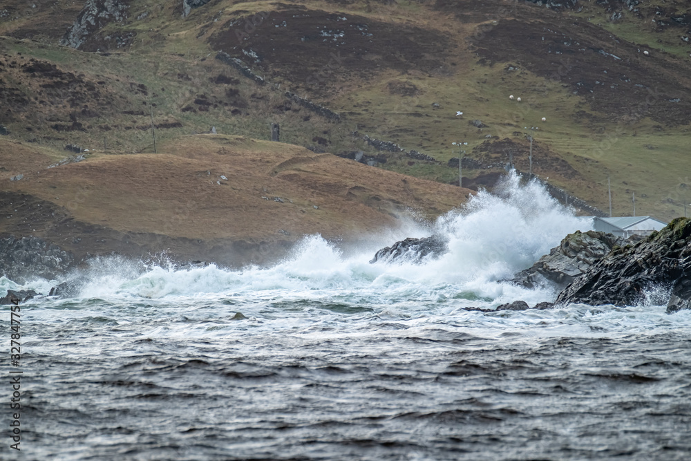 Waves crashing in to the cliffs of the west coast of County Donegal - Ireland Waves crashing in to the cliffs of the west coast of County Donegal - Ireland