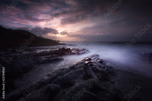 Morning at Bracelet Bay with a long exposure over the rock pools on the Gower peninsula in Swansea, South Wales, UK