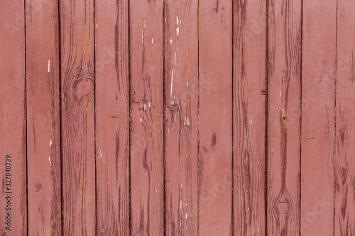 Surface of painted shabby wood. Red burgundy wooden boards texture background
