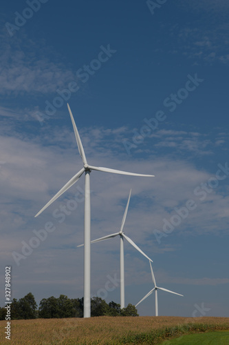Wind Turbines Against Blue Sky in Rural Area