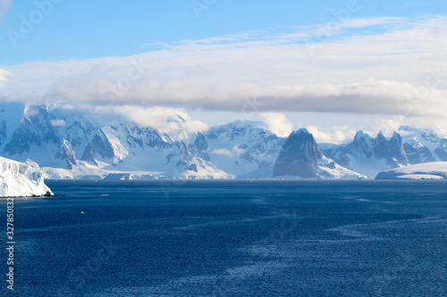 Snow-capped mountains and icy shores of the Bismarck Strait in the Antarctic Peninsula, Antarctica