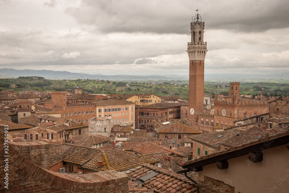 Scenery of Siena, a beautiful medieval town in Tuscany, view from the Dome & Bell Tower of Siena Cathedral (Duomo di Siena), landmark Mangia Tower in Piazza del Campo