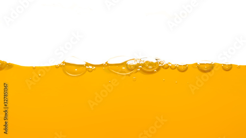 Orange water surface with bubble and water splash on white background