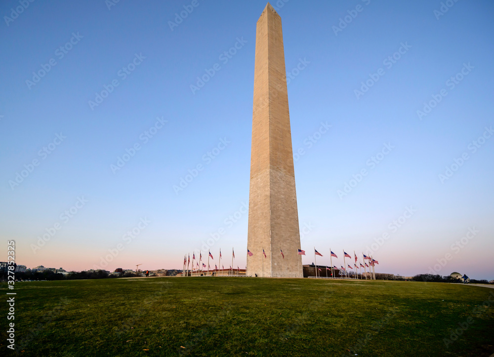 Sunset captured behind the circle of flags at the Washington Monument