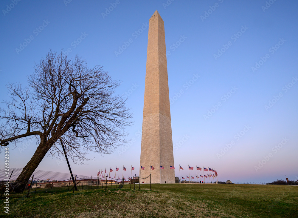 Sunset captured behind the circle of flags at the Washington Monument