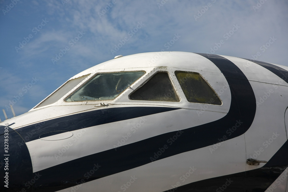 Airplane with white and black. Front window