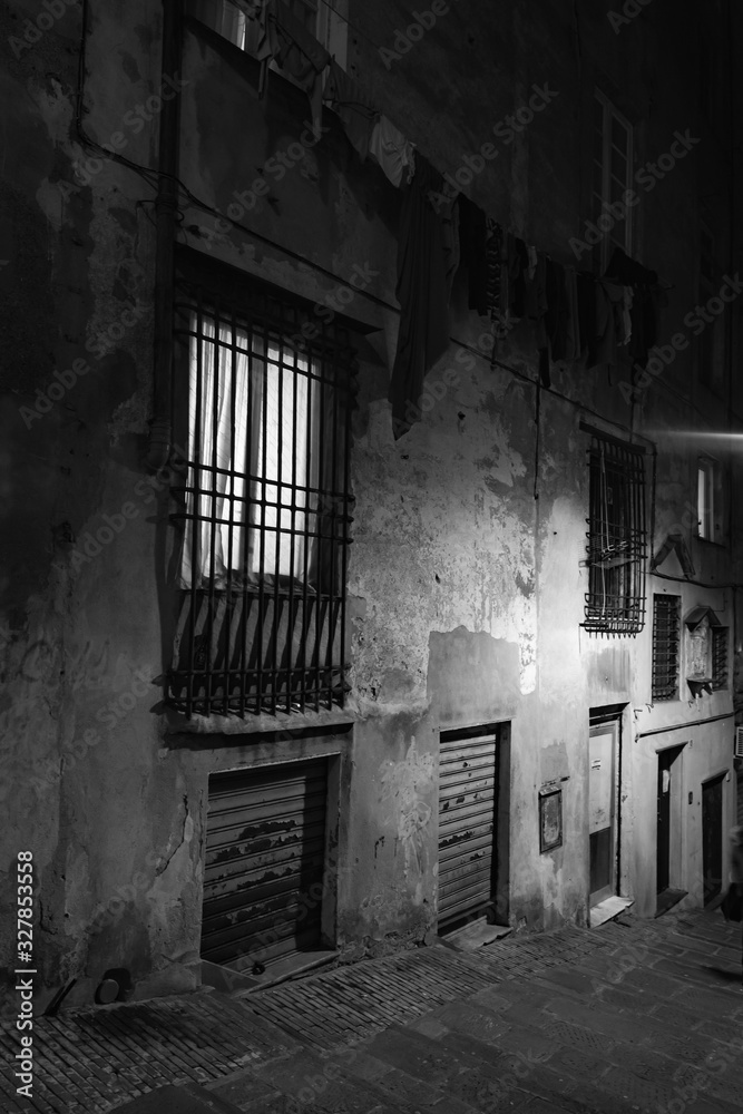 Vertical night street view of Genova old town Vertical night street view of Genova old town