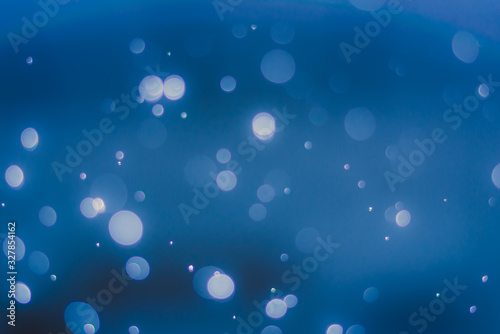 abstract sparkle bokeh light effect with dark blue background, abstract bokeh background