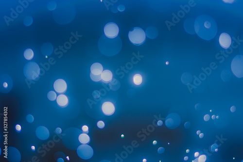 abstract sparkle bokeh light effect with dark blue background, abstract bokeh background
