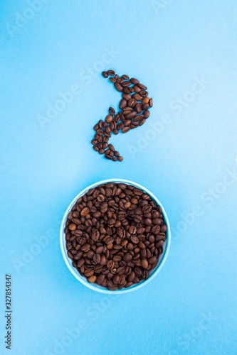 Cup with grains of coffee. Abstraction and coffee minimalism.