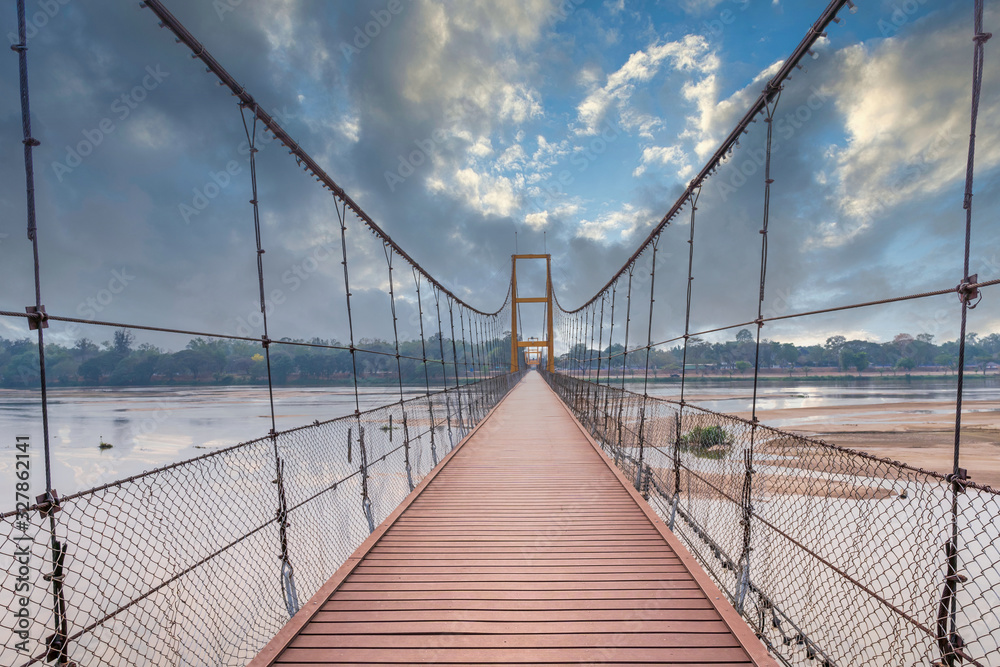 Obraz premium Rattanakosin 200 Year Anniversary Bridge against blue sky at Tak Thailand