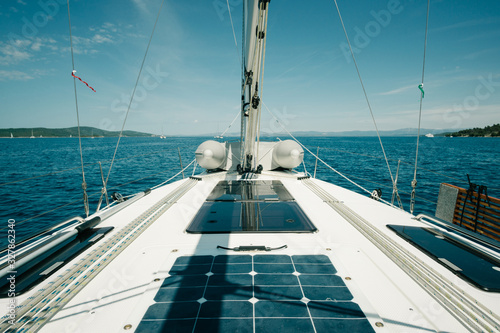 Ship deck on a yacht on the sea with blue sky. Sailing and yachting concept. photo