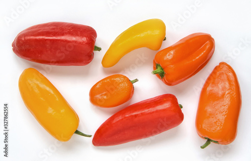 Fresh colorful bell peppers isolated on white background