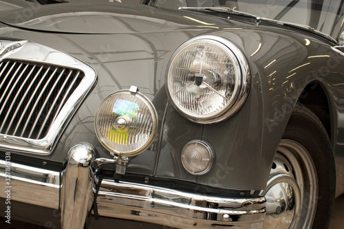 Headlights of British classic car. Antique Close up.