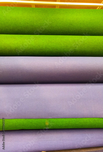 Beautiful colorful roll carpets in the store for service industry, blue green and red carpet