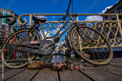 Ghent, Belgium, August 2019. A bike has been fished from the canal: it is rusty and full of dirt. It was left on the deck so that the owner could take it back.