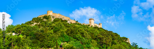 The Castle of Obidos on a forested hill top, a well-preserved medieval castle located in the civil parish of Santa Maria, São Pedro e Sobral da Lagoa in Obidos, Portugal