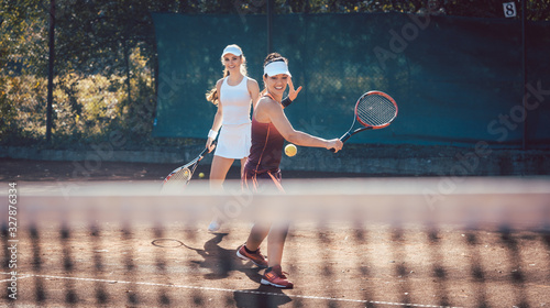 Woman in a tennis double © Kzenon