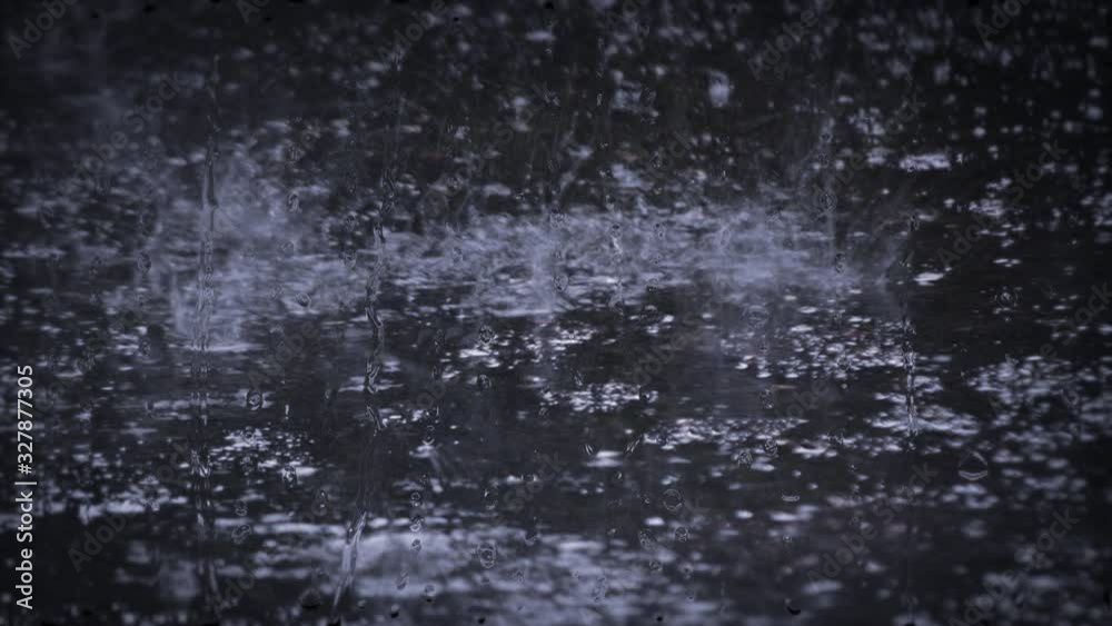 Heavy rain shower downpour cloudburst rainfall behind the glass. Heavy rain shower downpour cloudburst rainfall behind the glass.