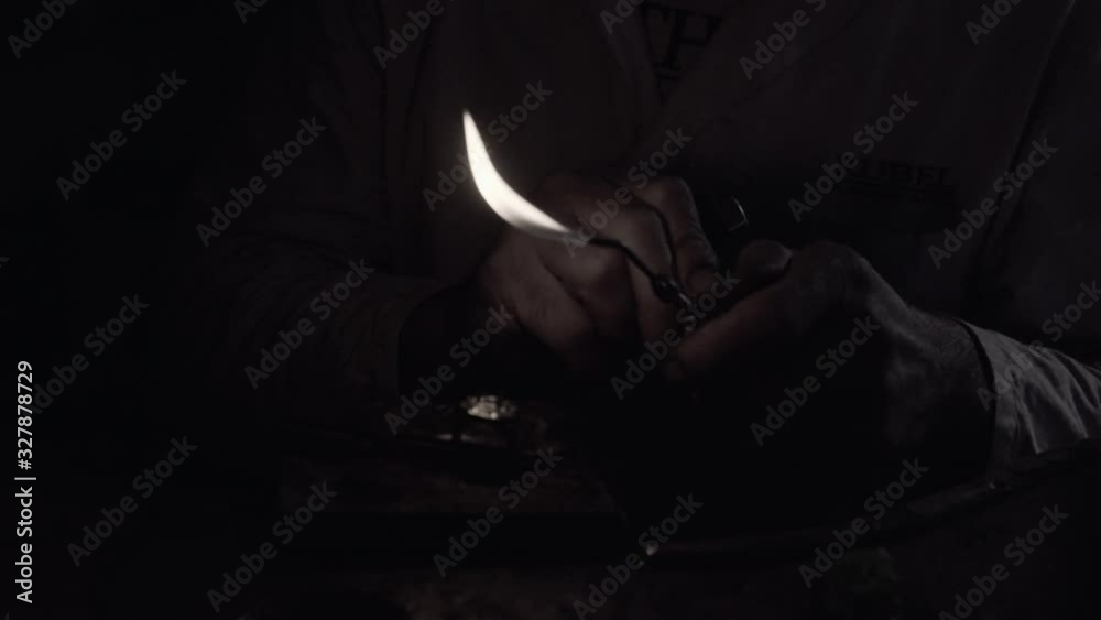 Man crafting a diamond ring jewel with his tools Man crafting a diamond ring jewel with his tools