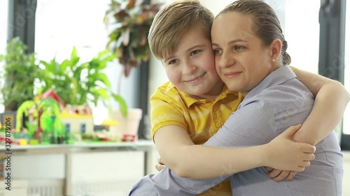 Portrait of mom and son. Happy mom and baby. Mom and son are hugging.