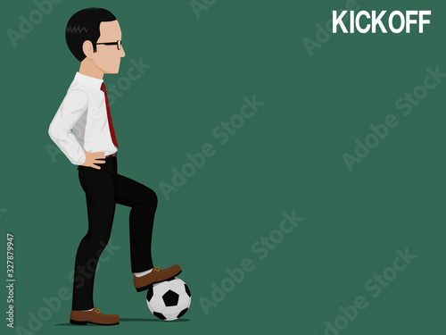 A businessman is playing football