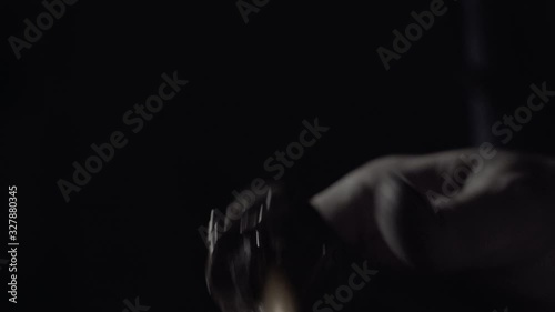Man crafting a diamond ring jewel with his tools 