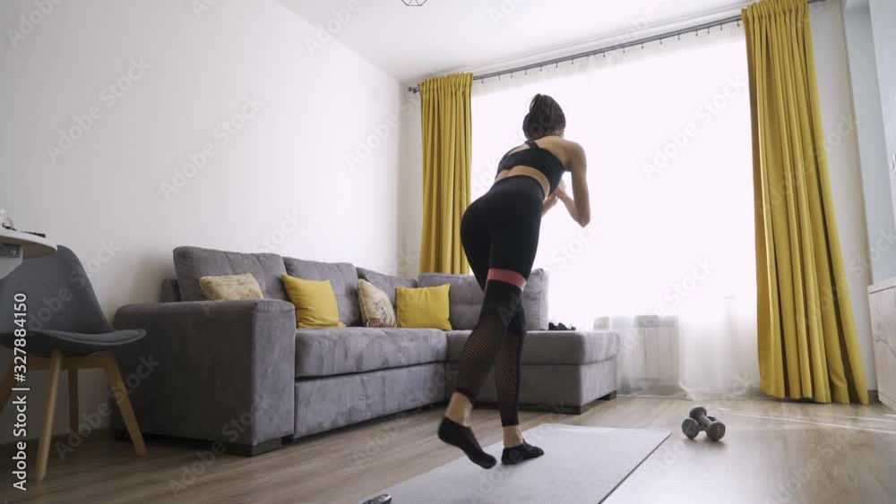 Sporty fit girl doing legs Exercises with Resistance Band Sporty fit girl doing legs Exercises with Resistance Band