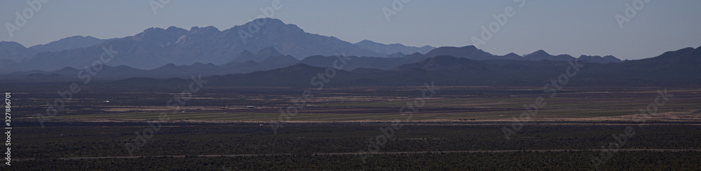 Scenic Arizona desert landscape with mountains and cactus fields