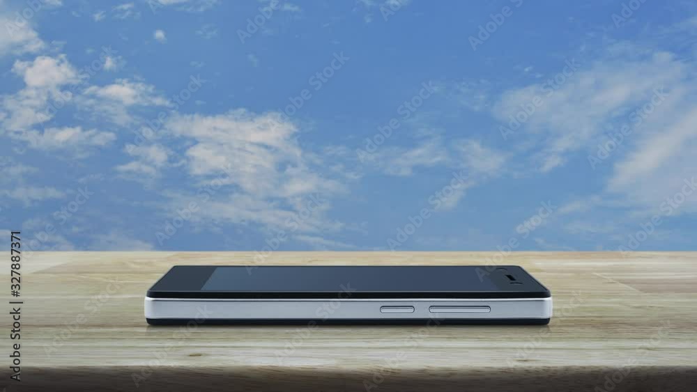 Restaurant cloche flat icon on modern smart mobile phone screen on wooden table over blue sky with white clouds, Business food delivery online concept Restaurant cloche flat icon on modern smart mobile phone screen on wooden table over blue sky with white clouds, Business food delivery online concept