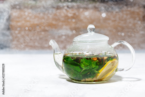 fresh mint tea in a glass teapot