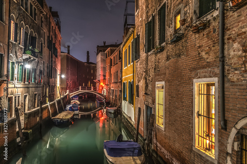 Small canal in Venice at night
