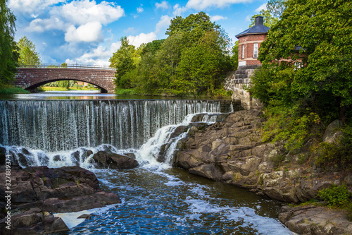The picturesque view of Vanhakaupunki, the oldest part of Helsinki. The Vantaa river landscape, old hydroelectric power station