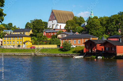 Best view of the town of Porwoo, Finland. Traditional colorful wooden houses on the Porvoonjoki river. Sunny day and blue sky. photo