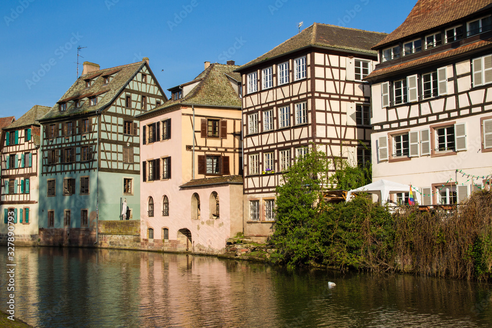 Medieval traditional half-timbered houses in the Petite France district. Pastel colors of early spring.  Strasbourg, Alsace, France.