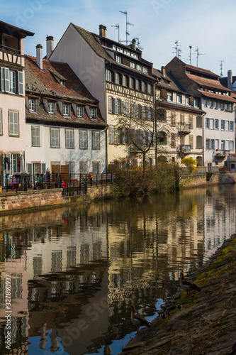 Medieval traditional half-timbered houses in the Petite France district. Pastel colors of early spring. Strasbourg, Alsace, France.