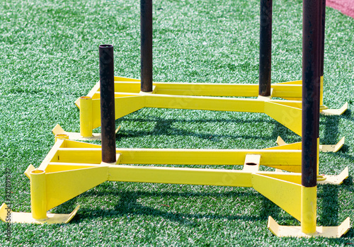 Two yellow exercise push sled on truf field photo