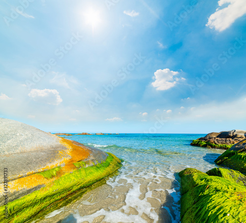 Sun shining over Orri beach in springtime photo