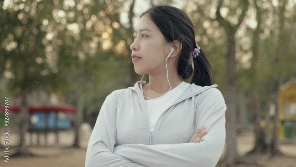 Attractive young female runner standing seaside relaxing on the beach after running, health lifestyle workout athletic. Attractive young female runner standing seaside relaxing on the beach after running, health lifestyle workout athletic.