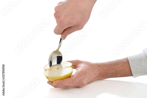 Lifehacks; Extracting the core of a pear with table spoon. 